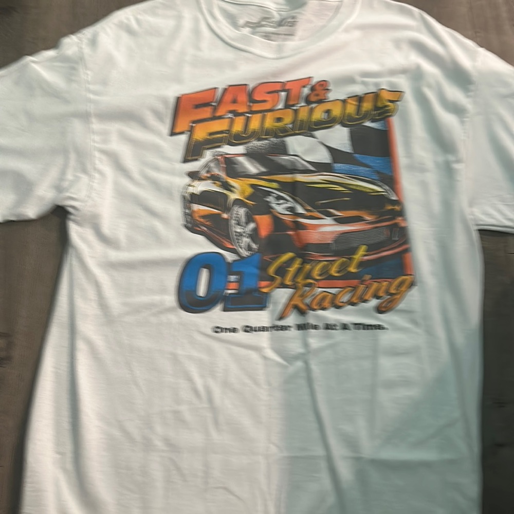 A a graphic tee shirt with the words fast and the furious kn the front